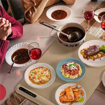 Foldable Food Heating Mat keeping various dishes warm at a dining table with wine glasses. - Astoria Lifestyle