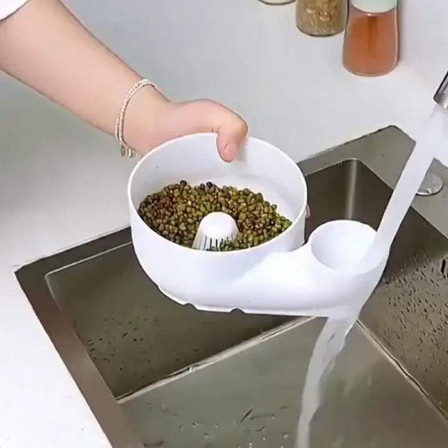 Fruit & Vegetable Washing Bowl. Person washing green beans in a kitchen sink using a white colander.