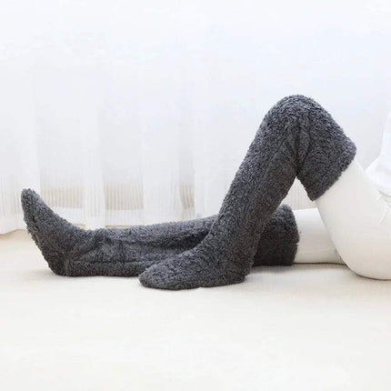 Gray Fuzzy Leg Warmer Stockings on a white surface with a light background