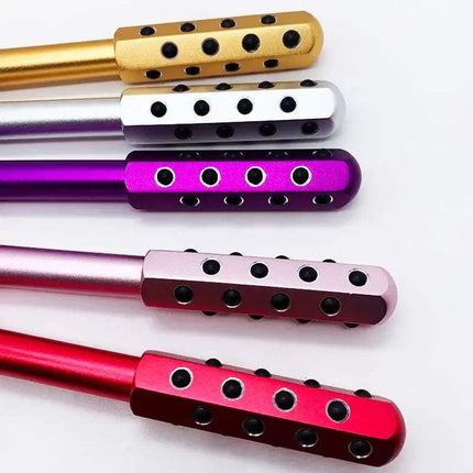 Set of colorful Germanium Beauty Roller with metallic finish on a white background