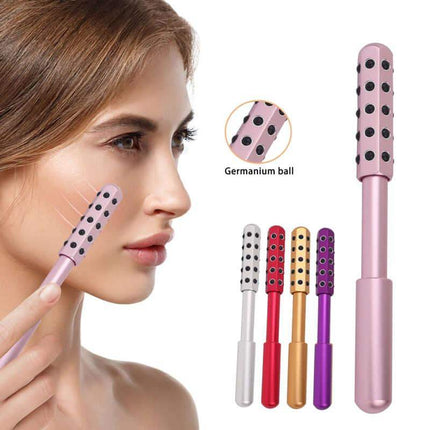 Woman using a Germanium Beauty Roller for Lifting & Facial Massage with different colored attachments on a white background