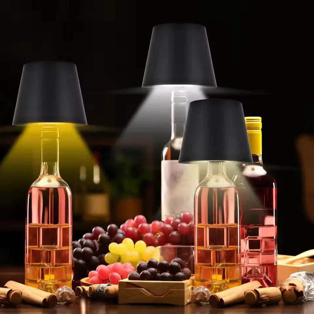 Wine bottles and grapes on a dark background with black LED Bottle Table Lamp.