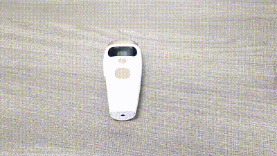 Laser Epilator Painless Hair Remover device displayed on a flat surface, showcasing its sleek design.
