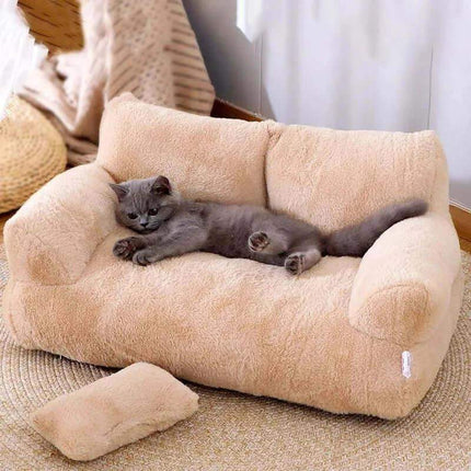 Luxury Cat Plush Bed Cat lying on a plush beige pet bed in a cozy room.