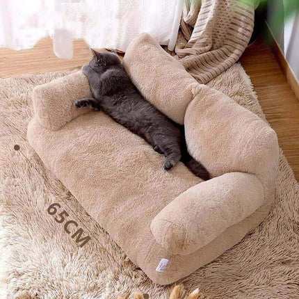 Luxury Cat Plush Bed Beige plush cushion with a cat lying on it, on a wooden floor.