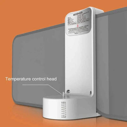 Portable Infant Bottle Warmer Temperature control head attached to a gray panel on an orange background
