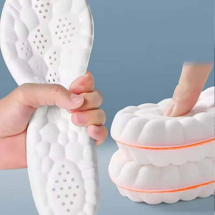 Shock Absorbing Shoe Inserts with a textured handle and a white shoe being cleaned on a gray background