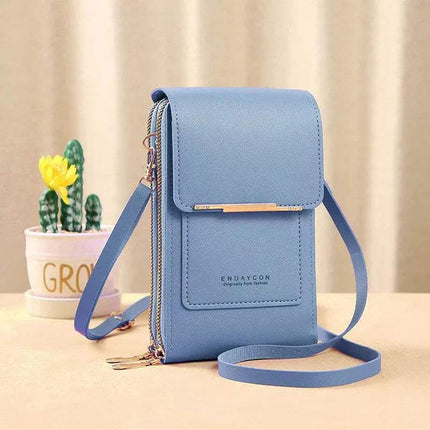 Blue Small Bag for Females with Transparent Touch Screen Area with a visible brand logo on a beige surface with a blurred background