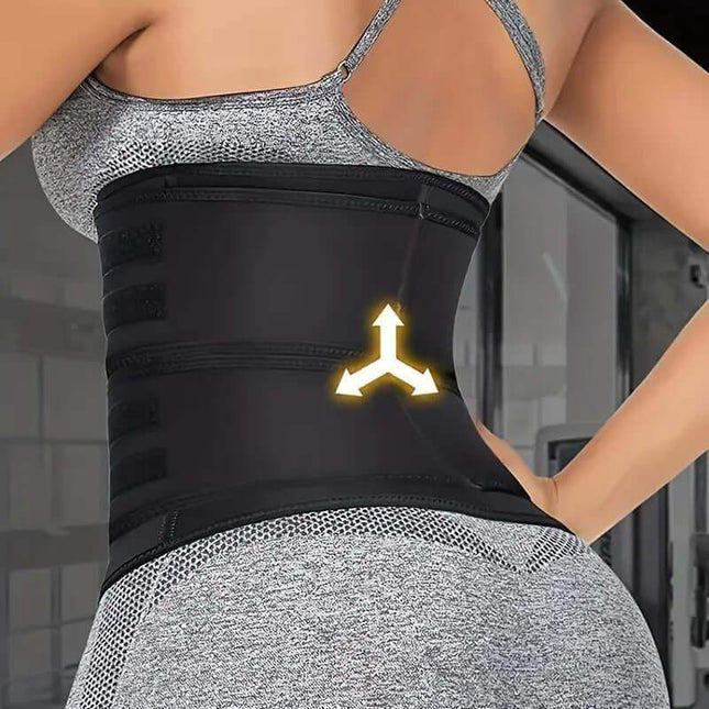 Person wearing Waist Belt Body Shaper with a logo, standing in a blurred indoor setting.