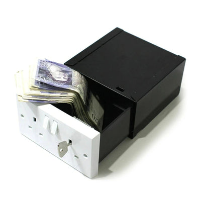 Wall Socket Safe Black and white with stacks of cash on a white background