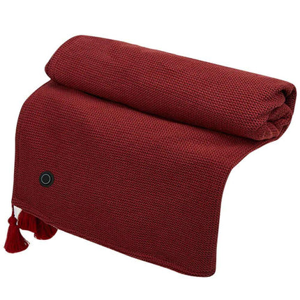 Folded red Wearable Electric Heating Blanket with tassels on a white background