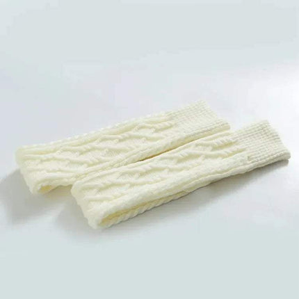 Pair of white knitted Winter Wool Over Knee Socks on a light gray background