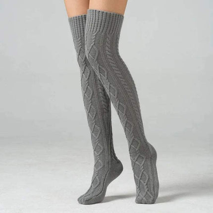 Gray knitted Winter Wool Over Knee Socks on a plain background