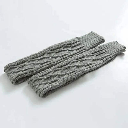 Pair of gray knitted Winter Wool Over Knee Socks on a white background