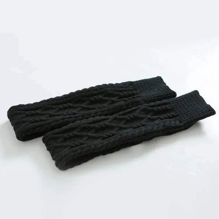 Pair of black knitted Winter Wool Over Knee Socks on a white background