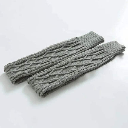 Pair of light gray knitted Winter Wool Over Knee Socks on a light gray background