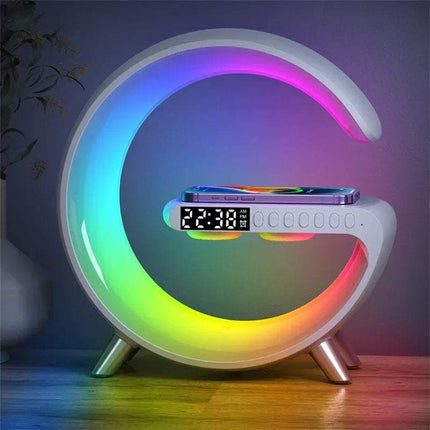 white Wireless Charging Bluetooth Lamp Colorful moon-shaped night light with digital clock on a wooden floor. Astoria Lifestyle