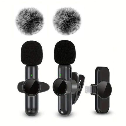 Wireless Lavalier Microphone. Two microphones with windshields and a clip-on device on a white background
