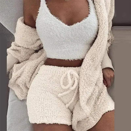 Person wearing a Womens Comfortable Knit Pajama Set white fuzzy outfit with a matching cardigan.