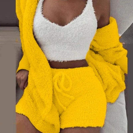 Person wearing a yellow Womens Comfortable Knit Pajama Set fleece outfit with a white top