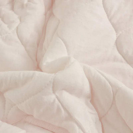 Close-up of a soft pink Baby Wrap Blankets Swaddle Cozy, Gentle, and Multi-Functional quilted fabric texture