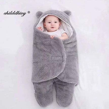 Baby wrapped in a gray Baby Wrap Blankets Swaddle Cozy, Gentle, and Multi-Functional with bear ears on a white background, brand 'childdkivy' visible.