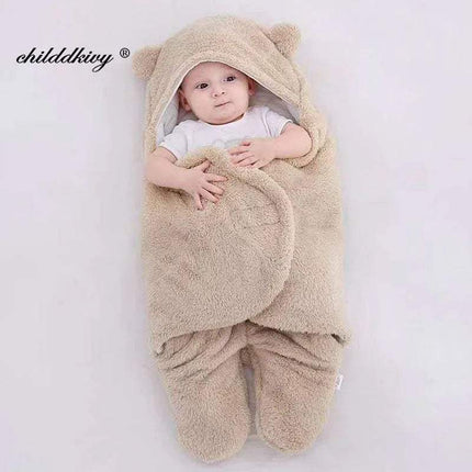 Baby wrapped in a beige Baby Wrap Blankets Swaddle Cozy, Gentle, and Multi-Functional with bear ears on a white background