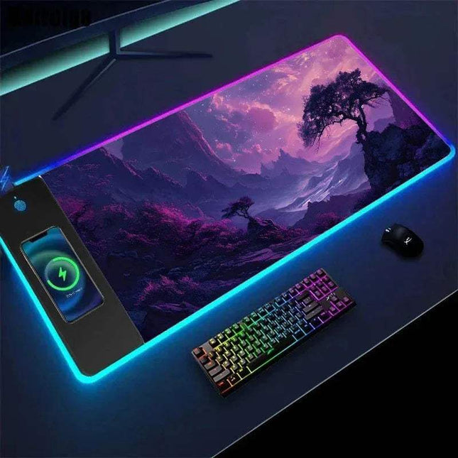 Gaming desk setup with a large Wireless Charging Mouse Pad Sakura featuring a mountain landscape, keyboard, and phone.