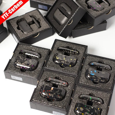 Multiple black earbud cases in packaging with a brand label in the corner.