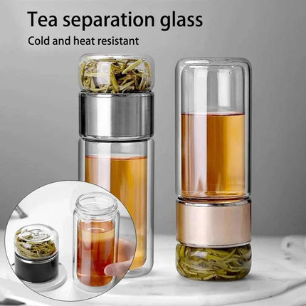Tea Infuser Bottle for Elegant Hot & Cold Brewing with tea leaves and liquid on a gray background