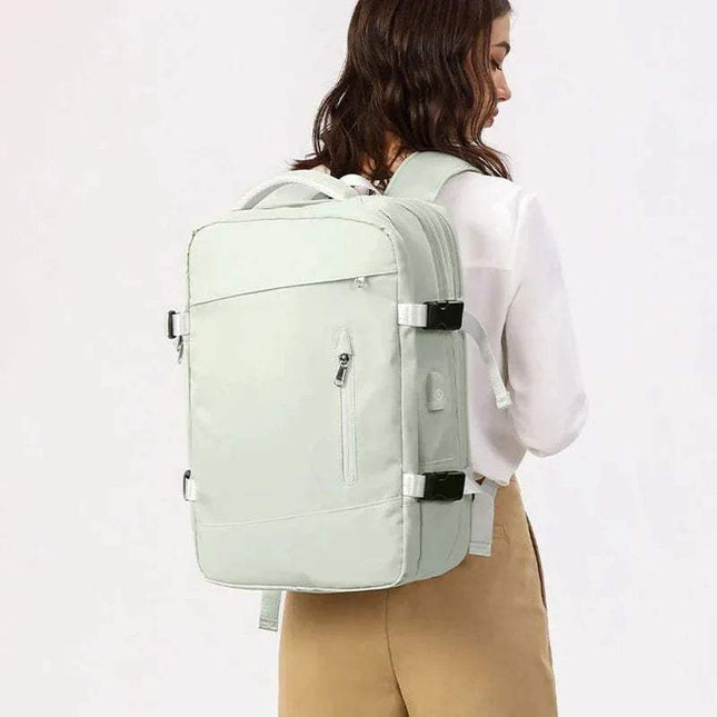 Person wearing a green Extendible Travel Backpack Unisex on a white background