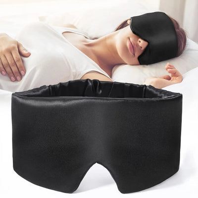 Mulberry Silk Sleep Mask a woman lying on a bed wearing it with a plain background