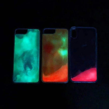 Three  Luminous Quicksand Phone Case with glowing designs on a black background - Astoria Lifestyle