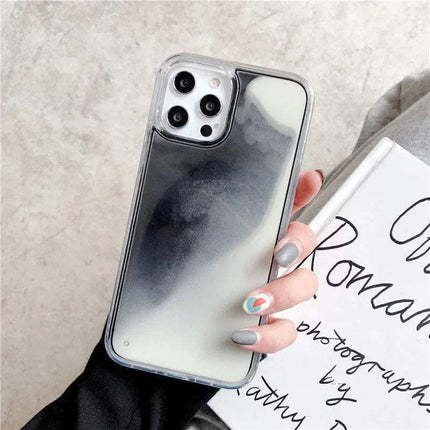 Luminous Quicksand Phone Case with a gradient design held by a hand on a textured surface - Astoria Lifestyle