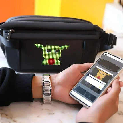 Person using a smartphone to control a Sling Bag with LED Display Bluetooth Programmable LED Fanny Pack on a black bag.
