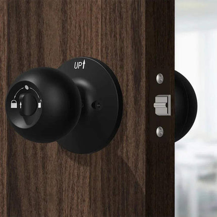 Smart Door Knob featuring a sleek black design mounted on a wooden door for advanced home security.