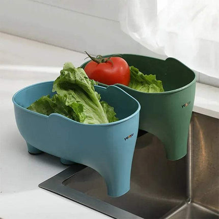 Two 2x Elephant Drain Baskets Cute & Functional Kitchen Sink Strainers with vegetables on a kitchen counter.