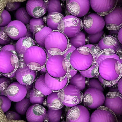 Close-up of purple Automatic Rolling Ball Cat Toy with clear centers.
