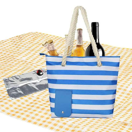 Blue and white striped Insulated Tote Bag with Drink Dispenser Stylish Leakproof Beverage Tote with bottles on a yellow checkered blanket
