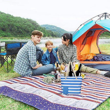 Family having a picnic by a lake using Insulated Tote Bag with Drink Dispenser Stylish Leakproof Beverage Tote with an open tent in the background