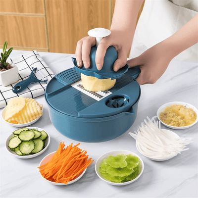 Person using a blue vegetable chopper with various chopped vegetables on a table.