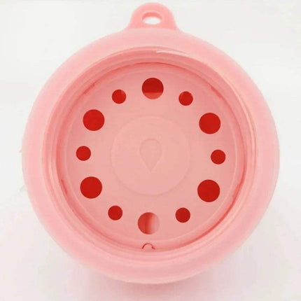 Close-up view of Portable Pet Water Drinking Bottle showing the interior design and water release holes.
