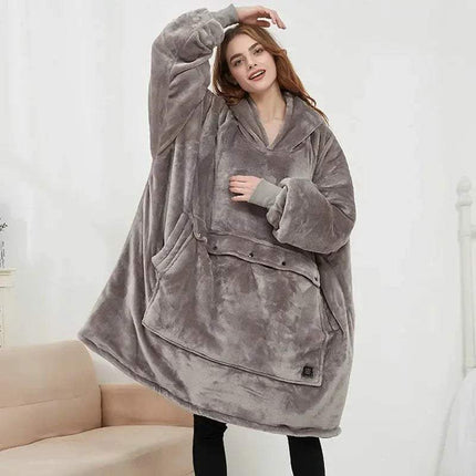 Person wearing a gray fleece Oversized Heatable Hoodie and pockets on a white background