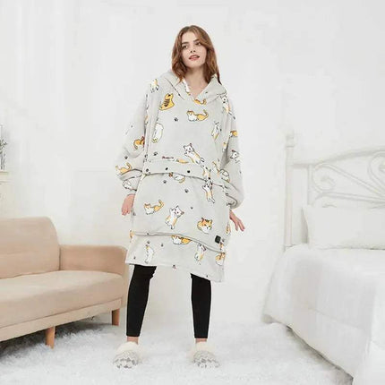 Woman wearing a light gray cat Oversized Heatable Hoodie in a minimalistic room.
