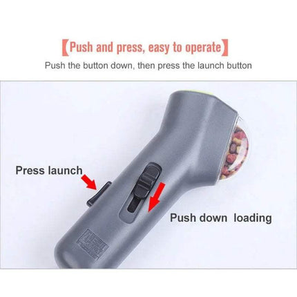 Gray Dog Treat Launcher Interactive Training & Play Toy with instructions on how to operate it, including 'Push and press, easy to operate' text.