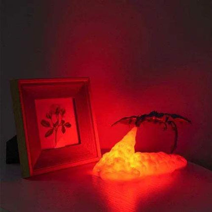 Dragon Lamp illuminating a room with a fire-breath effect next to a framed photo.