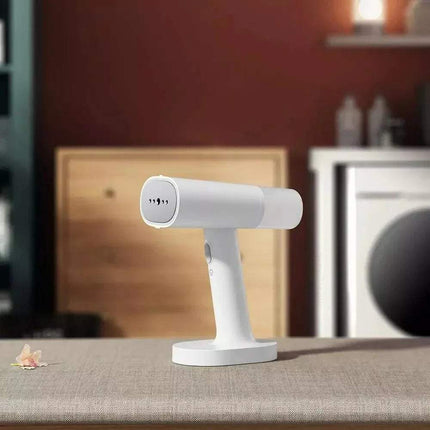 Handheld Garment Steamer for Fast Wrinkle-Free Clothes on a surface with a blurred background