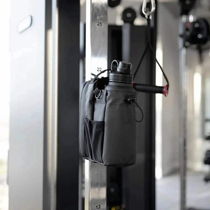 Black Magnetic Water Bottle Bag  attached to a gym machine