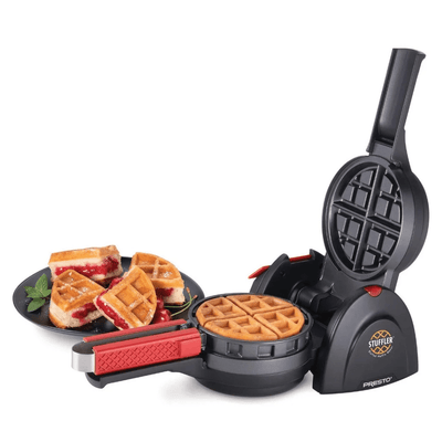 Waffle maker with waffles and a plate of waffle sandwiches on a white background