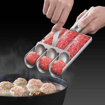 Person using a Triple Meatball Maker Stainless Steel to form ground meat into balls over a pan of boiling water.